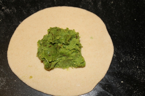 Place ball of the peas paste stuffing in the center of this chapatti